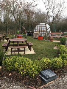 Seating area in the community garden at Prenton Rugby Club