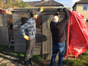 Repairing the shed roof at St James Community Garden
