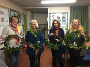 Showing off the results of the willow weaving workshop